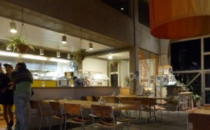 Residents linger in the Craft III café at night.